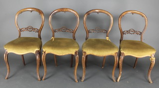 A set of 4 Victorian bleached mahogany balloon back dining chairs with shaped mid rails, the seats of serpentine outline, frames loose