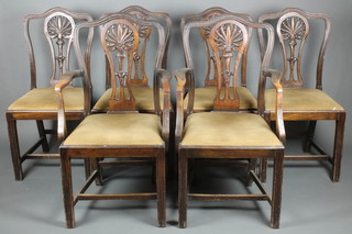 A set of 6 Hepplewhite style mahogany dining chairs with pierced vase shaped slat backs and upholstered seats, raised on square tapering supports united by a box stretcher 
