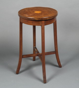 An Edwardian circular inlaid mahogany jardiniere stand with X framed stretcher, raised on outswept supports 23"h x 14" diam. 