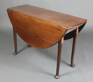 A Georgian mahogany oval drop flap dining table raised on club supports 28"h x 42 1/2"w x 14"l closed (45 1/2" when extended)