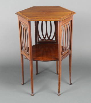 An Edwardian hexagonal inlaid mahogany occasional table with undertier and fretwork panels to the side, raised on 6 square tapered supports 27"h x 20"w x 17"d 