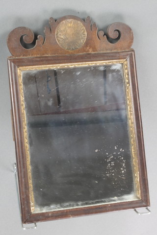 A Chippendale style rectangular plate mirror contained in a carved walnut frame 15"h x 9 1/2"w 