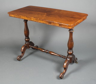 A Victorian rectangular rosewood stretcher table raised on a turned column with H framed stretcher 28"h x 36"w x 18"d 