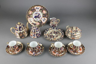 A Royal Crown Derby Japan pattern plate 8 1/2", a Davenport Japan pattern part coffee set, a 19th Century teapot and 3 dishes 