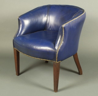 A mahogany framed tub back chair upholstered in blue rexine
