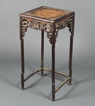 A Chinese square hardwood occasional table with carved and pierced apron raised on turned supports 24"h x 11 1/2"w x 11 1/2"d  