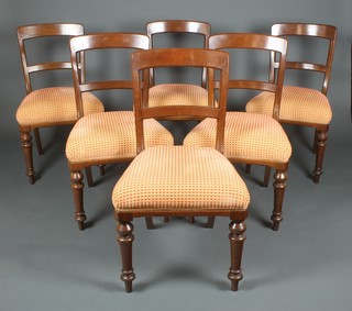A set of 6 Victorian mahogany bar back dining chairs with plain rectangular mid rails and upholstered seats, raised on turned supports