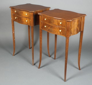 A pair of Victorian style mahogany lamp/bedside tables of serpentine outline, fitted 2 short drawers, raised on out swept supports 27 1/2"h x 17"w x 14"d 