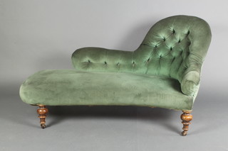 A Victorian shaped chaise longue, raised on turned supports upholstered in blue buttoned material, 30"h x 53" x 27"d 