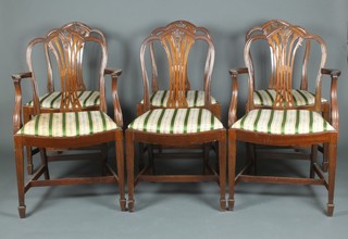 A set of 6 Hepplewhite style mahogany camel back dining chairs - 2 carvers, 4 standard, with upholstered drop in seats, raised on fluted tapered supports, spade feet 