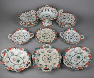 A 19th Century ironstone dinner service comprising 15 plates, 5 serving dishes and a 2 handled tazza 