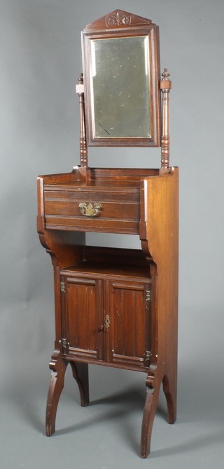 Maples & Co, an Edwardian walnut ships style wash stand with rectangular bevelled plate mirror, the base fitted 1 long drawer above a recess with double cupboard 68"h x 18"w x 13 1/2d 