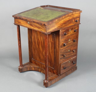 A 19th Century mahogany Davenport desk with three-quarter gallery, inset a leather writing surface, the pedestal fitted an ink well and drawer above 4 long drawers, raised on a turned column 31"h x 22"w x 23"w 