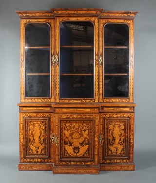A 19th Century Dutch inlaid marquetry breakfront cabinet on cabinet, the upper section with moulded cornice above cupboards fitted adjustable shelves enclosed by panelled doors, the base fitted cupboards enclosed by inlaid panelled doors 81"h x 60"w x 16"d 