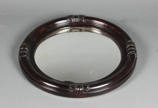A Victorian convex plate wall mirror contained in a carved mahogany frame 20" 