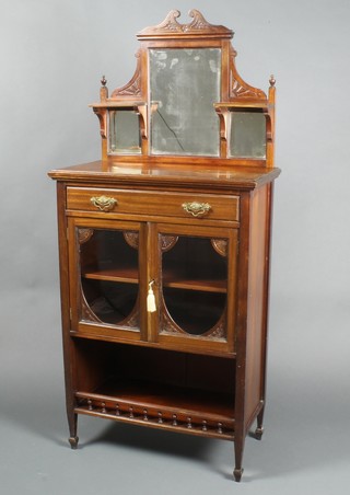 An Edwardian walnut chiffonier with raised mirrored back, having 2 shelves to the side, the base fitted 1 long drawer above cupboard enclosed by a glazed panelled door above a recess with bobbin turned decoration, raised on square supports 57"h x 26"w x 14"d 