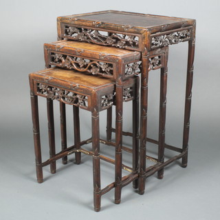 A nest of 3 Chinese carved hardwood interfitting tables with carved and pierced aprons 28"h x 20"w x 19"d