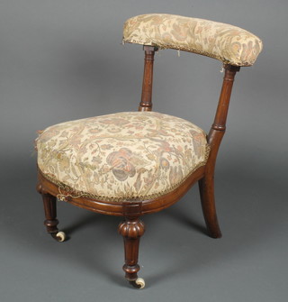 A Victorian mahogany bar back nursing chair with turned and fluted columns and upholstered seat 