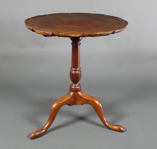 A Chippendale style circular mahogany snap top tea table raised on a pillar and tripod base 27"h x 24" diam. 