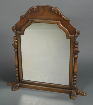 A Queen Anne style arched plate dressing table mirror contained in an oak and walnut frame 29"h x 27"w