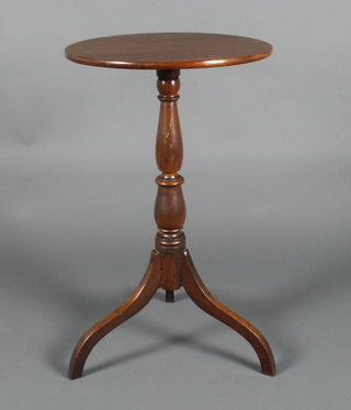 A 19th Century circular mahogany wine table raised on pillar and tripod base 28"h x 17" diam. 