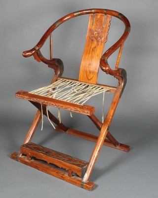 A Chinese hardwood folding chair with woven hide seat 