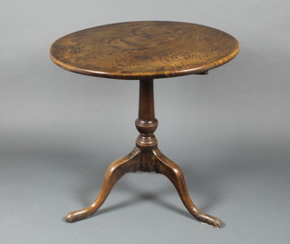 An 18th/19th Century circular elm snap top tea table, raised on pillar and tripod base 27"h x 28" diam. 