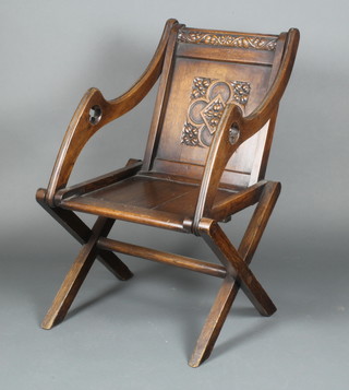 A carved oak Glastonbury chair 