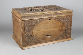 An Indian heavily carved hardwood trinket box with hinged lid and fitted interior, the base fitted a drawer 10"h x 16"w x 10 1/2"d