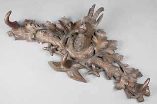 A 19th Century carved wooden coat rack with goat mask and carved acorns 12"h x 24"w 