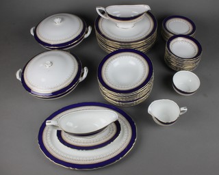 A Royal Worcester Regency pattern dinner service comprising 2 tureens and covers, a cream jug, sugar bowl, 12 bowls, 12 dinner plates, 2 sauce boats 1 with stand an oval serving plate, 12 small plates and 12 bowls 