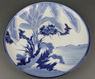 An early 20th Century blue and white charger decorated with a stylised tree 16" 