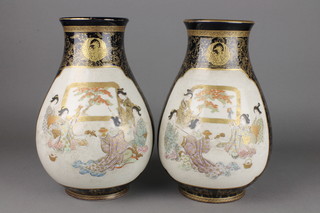 A pair of early 20th Century Japanese Satsuma baluster vases, the blue ground with panels of ladies at pursuits with stylised gilt mon 11" 
