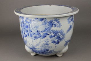 A 19th Century Japanese jardiniere decorated with scrolling flowers on stylised scroll feet 12" 