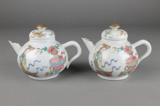 A pair of 19th Century famille rose teapots decorated with figures 4" 