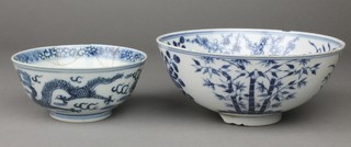 A Chinese 18th Century blue and white deep bowl decorated with stylised flowers and bamboo 7", a smaller ditto decorated with flowers 4"