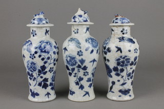 3 19th Century Chinese blue and white oviform vases and covers decorated with scrolling peonie 8 1/2" 