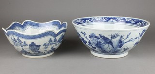 A 19th Century Chinese blue and white deep bowl, the centre panel decorated with a rocky outcrop and flowers 12", a ditto decorated with an extensive scrolling landscape 9" 