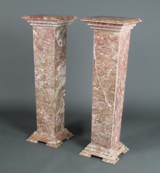 A pair of polished granite square pedestals raised on stepped bases 41"h x 12"w x 12"d 