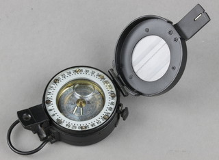 A metal military style prismatic compass, the base marked M-73 Pat appl.