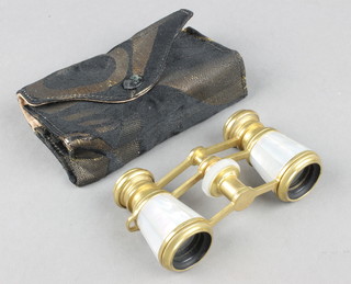 A pair of gilt metal and mother of pearl opera glasses marked Jumelle Carpentier