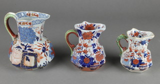 A matched set of 3 19th Century ironstone jugs with serpent handles 3", 4" and 5" 