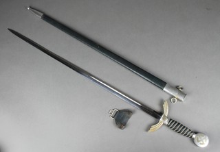 A World War Two 2nd issue officers Luftwaffe dress sword.  The 30" blade marked SMF Solingen with leather and chrome scabbard