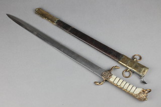 J Gieves & Sons of Portsmouth, a Victorian Midshipman's dirk, the etched blade with crowned Royal cypher and crowned anchor complete with leather scabbard, formerly the property of Captain K M Bruce DSO,  see also lots 976 and 716