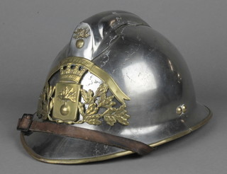 A polished steel French Fireman's helmet