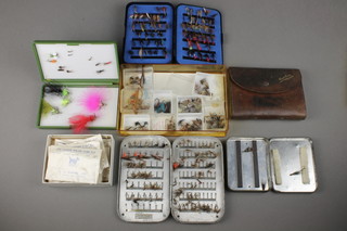 A J P Moreton metal fly box containing a collection of various flies, a leather fly wallet, The Lock Leven Eyed fly box, various Parker Major tube flies, a Greenwell black box of flies and a green plastic box containing various flies 