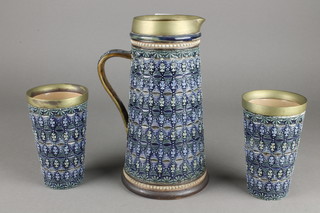 A Doulton Lambeth tapered jug, the blue ground with geometric decoration and plated mounts 9", 2 matching beakers