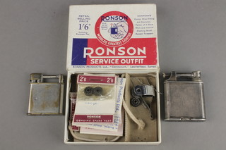 A Dunhill lighter, the base marked patent no. 39107, a Beeney lighter, a Ronson Service Unit boxed 