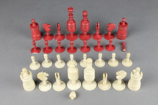 A 19th Century red and white barleycorn pattern carved ivory chess set