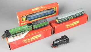 A Triang model of a double headed locomotive contained in a French Triang box, a Triang model of a double headed locomotive R339 boxed,  a Triang model R851 Flying Scotsman tender coupling (some damaged) boxed together with an electric tank engine 